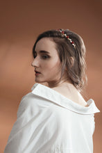 Load image into Gallery viewer, Model in white shirt wearing modern lux hair Jewelry VICTORIA Headband set with Carnelian beads and fresh water pearl in 14k gold plated metal 
